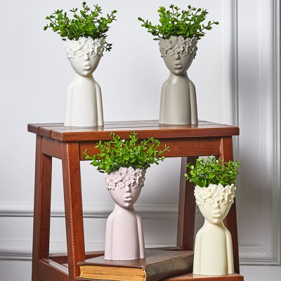 ΔΙΑΚΟΣΜΗΤΙΚΗ ΓΛΑΣΤΡΑ ΑΝΘΡΩΠΑΚΙ ΜΕ ΑΝΘΟΣ 22x9cm